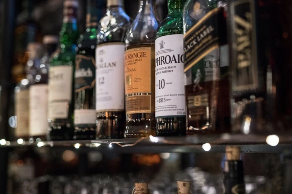 Premium whiskey and spirit bottles displayed on the bar at Blueprint on 3rd in Birmingham