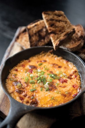 Warm skillet appetizer served with toasted bread at Blueprint on 3rd in Birmingham