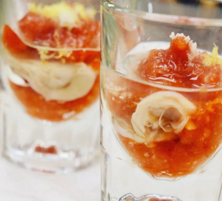 Individual seafood and tomato appetizers served in chilled glasses with citrus zest at Blueprint on 3rd