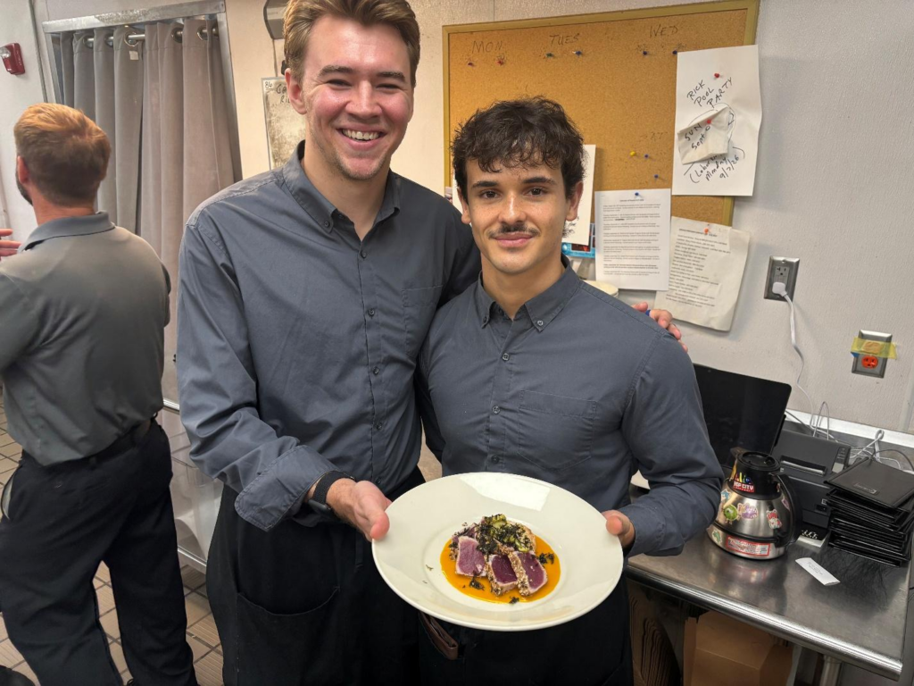 Blueprint on 3rd team members holding a plated dish in the restaurant's service area in Birmingham